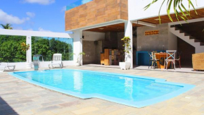 Casa com piscina privativa e poucos passos do mar at Cotovelo por Carpediem